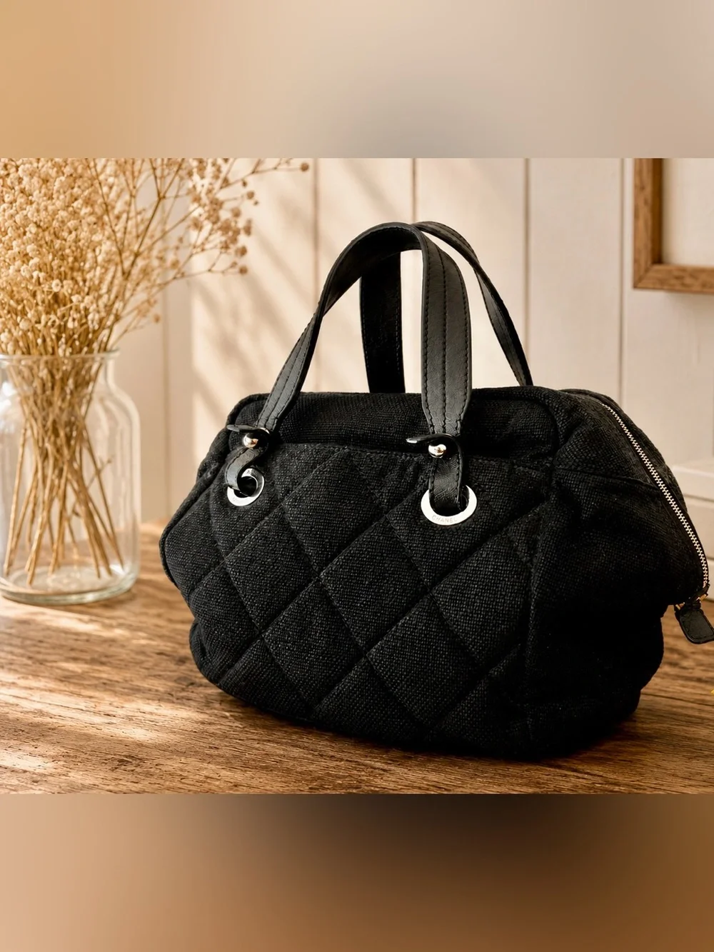 Authentic Chanel Biarritz quilted canvas bowler bag.